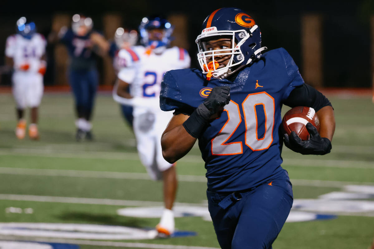 Bishop Gorman running back Noah Cole (20) sprints up the field with the ball during the footbal ...