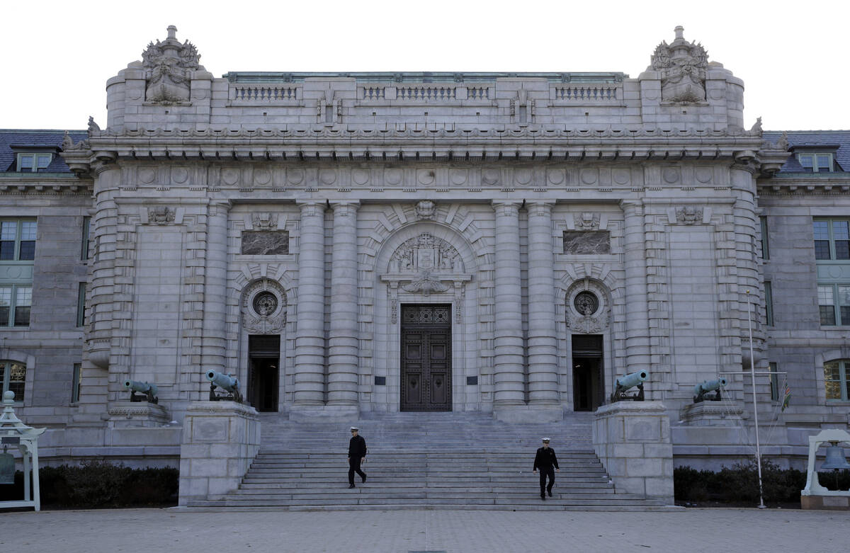 FILE - Midshipmen walk down the front steps of Bancroft Hall, the main dormitory on the U.S. Na ...