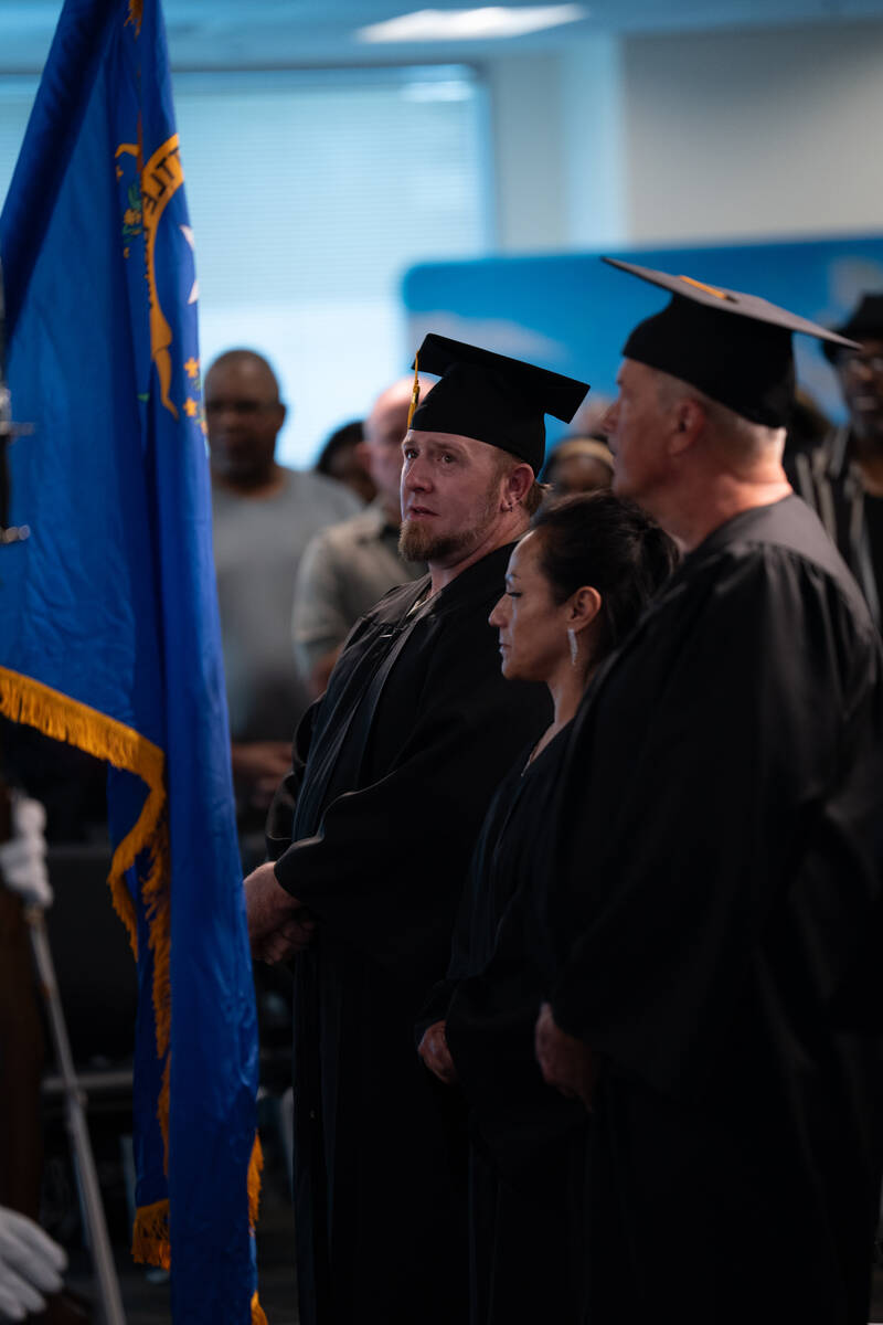 Kalub Jensen becomes emotional during the Pledge of Allegiance at the start of a graduation cer ...
