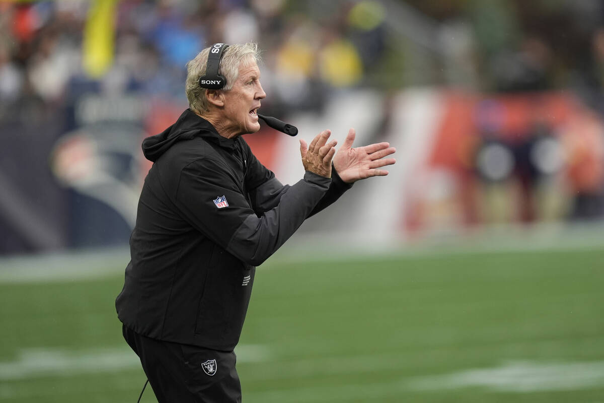 Las Vegas Raiders head coach Pete Carroll motions during the second half of an NFL football gam ...