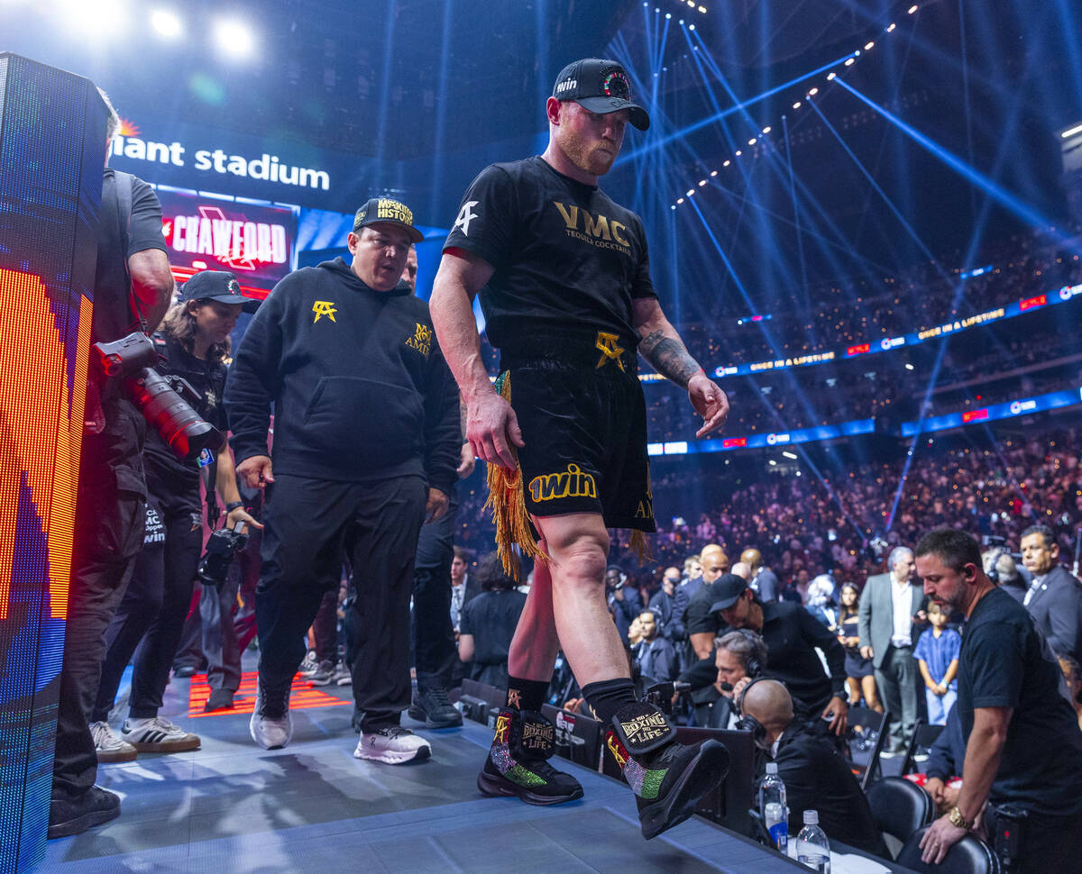 Canelo Alvarez walks from the ring after losing to Terence Crawford during their undisputed sup ...