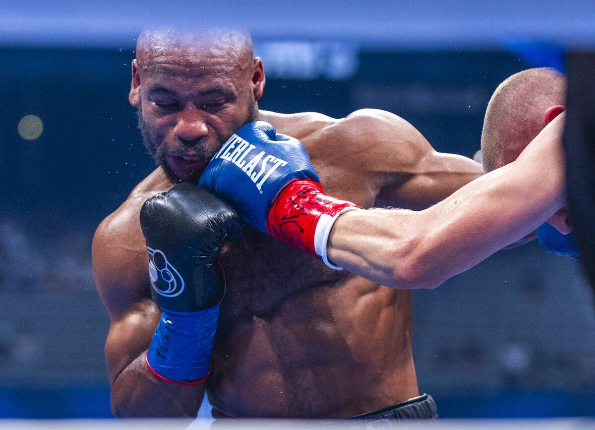 Brandon Adams takes shot to the chin from Serhii Bohachuk during their middleweight fight at Al ...