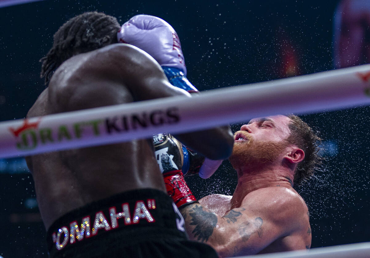 Terence Crawford connects with a punch to the chin of Canelo Alvarez during their undisputed su ...