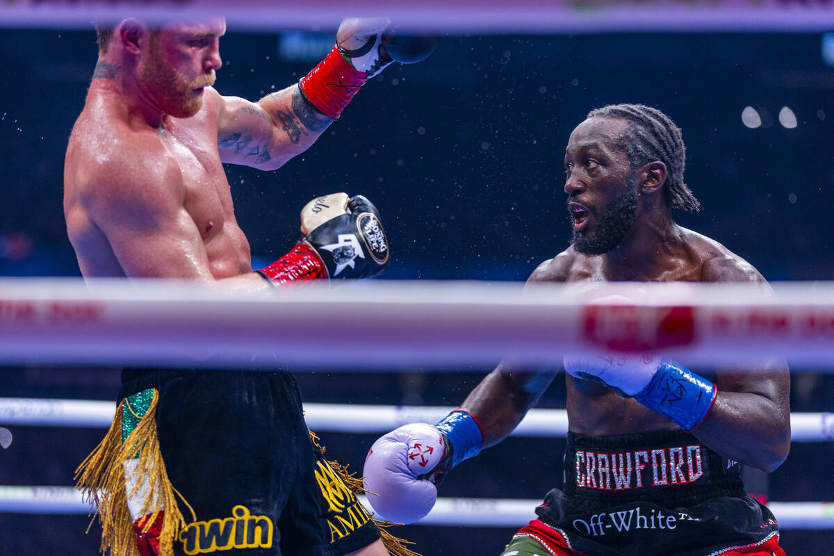 Canelo Alvarez reels back from blow by Terence Crawford during their undisputed super middlewei ...