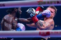 Terence Crawford connects with a punch to the face of Canelo Alvarez during their undisputed su ...