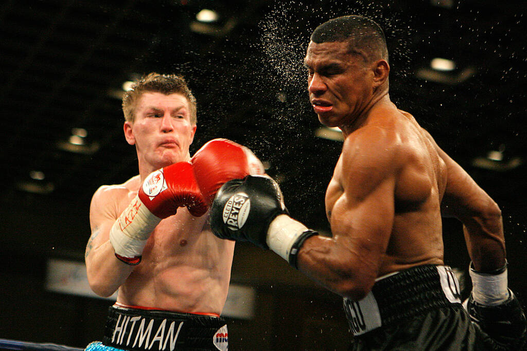 Ricky Hatton, left, of England, lands a right to the face of Juan Urango, of Colombia, in the f ...