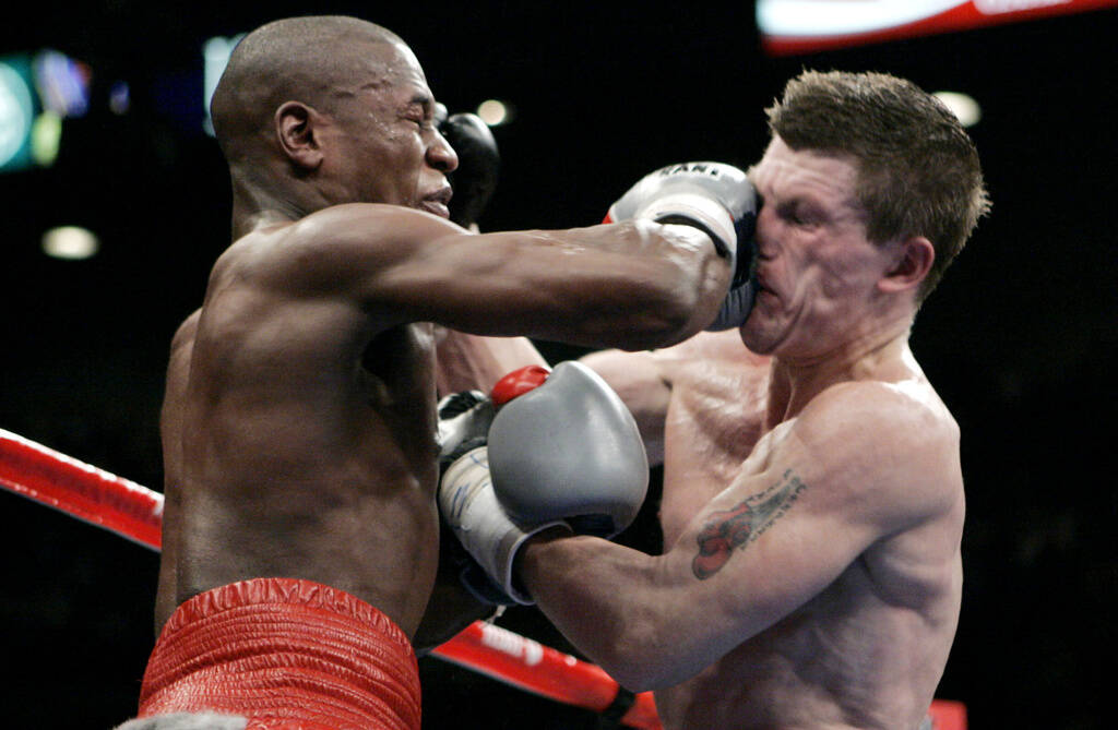 Floyd Mayweather Jr., left, punches Ricky Hatton, of Great Britain, during their WBC welterweig ...