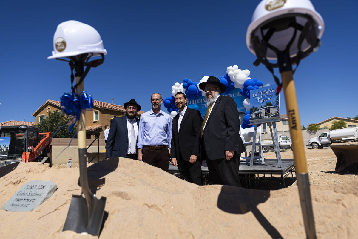 Rabbi Levi Wilhelm, from left, Clark County commissioners Justin Jones and Michael Naft, and Ra ...