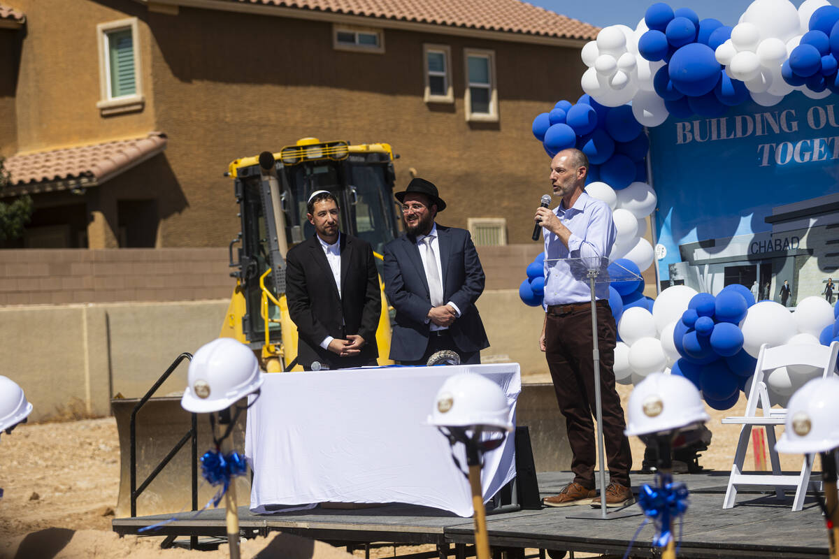 Clark County Commissioner Justin Jones, right, speaks alongside Rabbi Levi Wilhelm, center, and ...