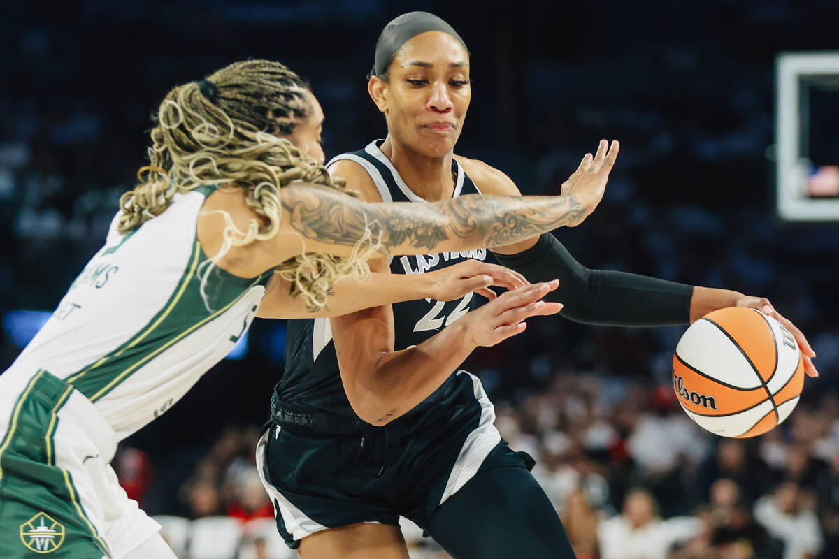 Aces center A'ja Wilson (22) dribbles the ball during game one of a first round WNBA playo ...