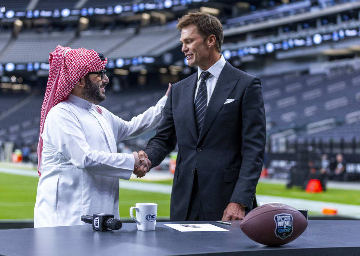 Turki Alalshikh with Riyadh Season and Tom Brady shake after signing a letter of commitment joi ...