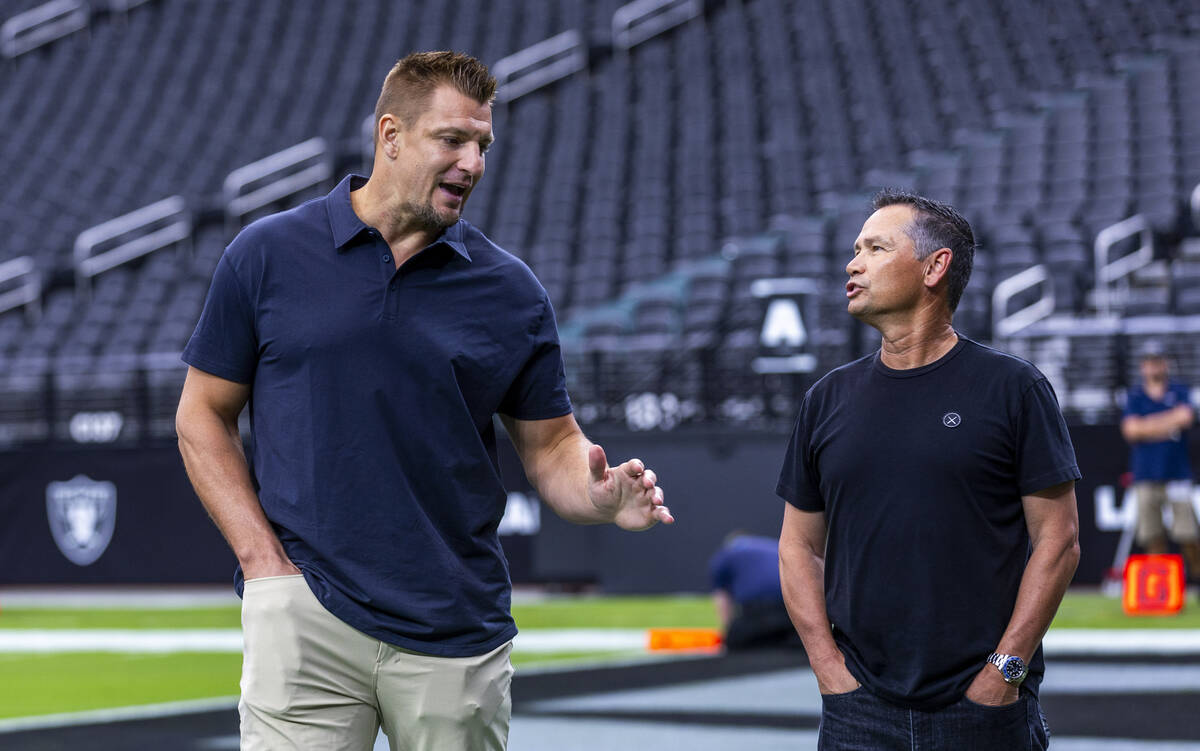 Rob Gronkowski talks with a friend while Tom Brady again as they join Turki Alalshikh with Riy ...