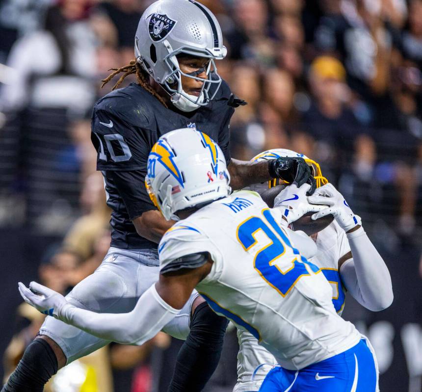 Los Angeles Chargers safety Tony Jefferson (23) intercepts a long pass to Raiders wide receiver ...