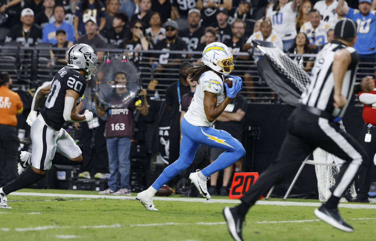 Los Angeles Chargers wide receiver Quentin Johnston (1) runs for a touchdown as Raiders safety ...