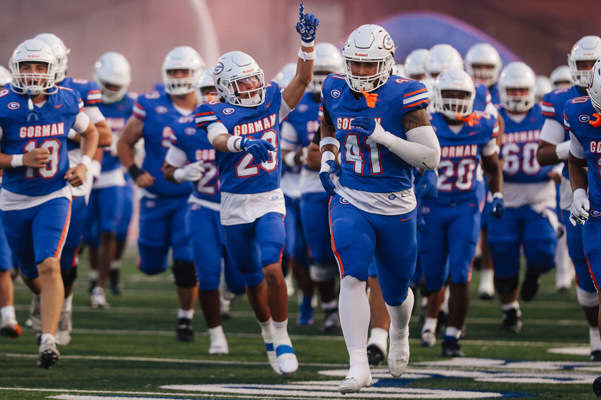Bishop Gorman prayers take to the field during a high school football game between Lone Peak an ...