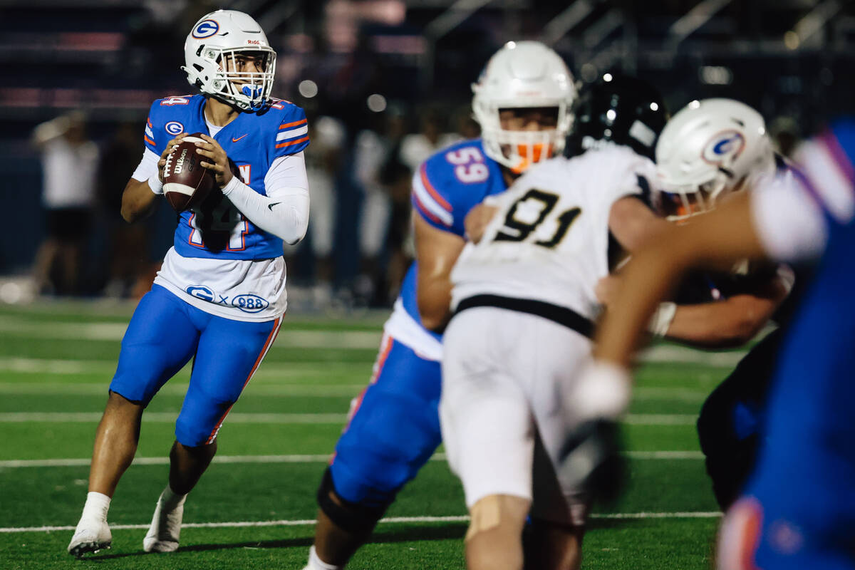 Bishop Gorman quarterback Maika Eugenio looks to throw the ball during a high school football g ...
