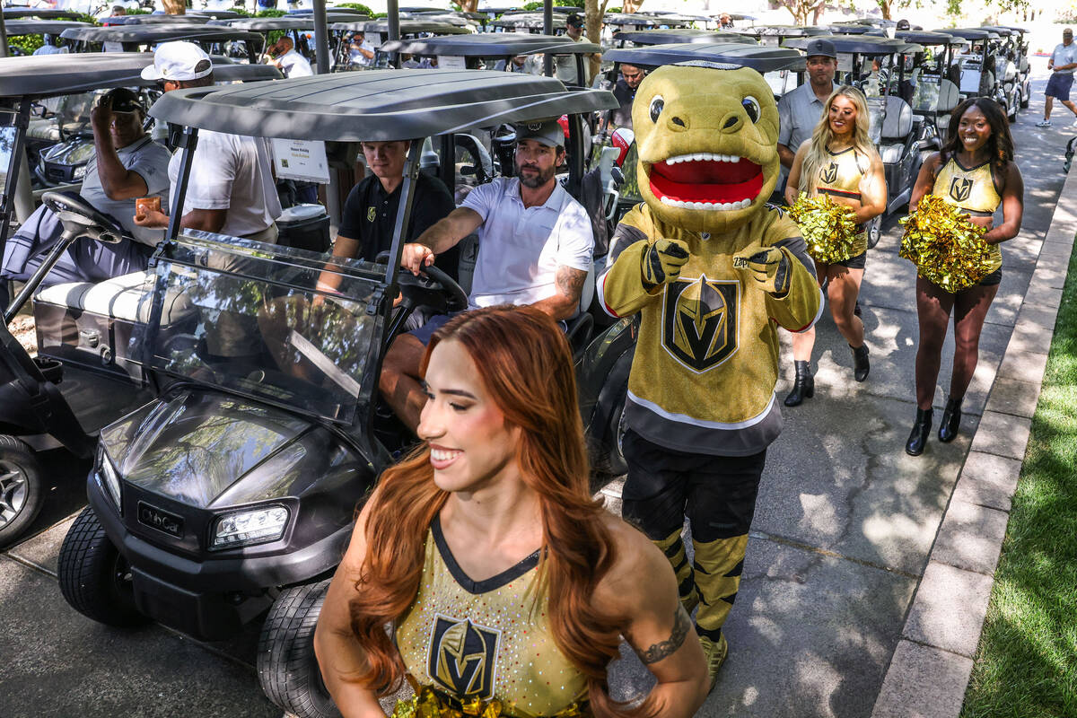 Chance and the Vegas Vivas' pass by former Golden Knights defenseman Deryk Engelland befor ...