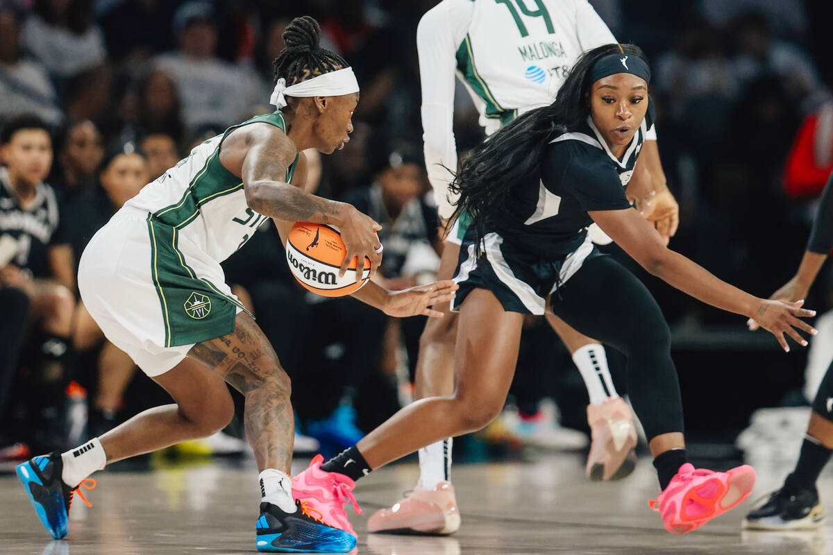 Aces guard Dana Evans (11) guards Seattle Storm guard Erica Wheeler during game one of a first ...