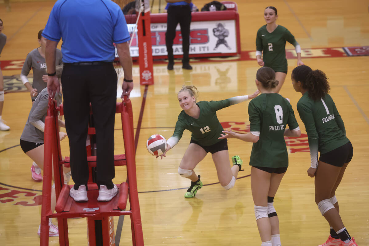 Palo Verde middle blocker Alexis Lunkwitz (12) tries to save the ball during a volleyball game ...