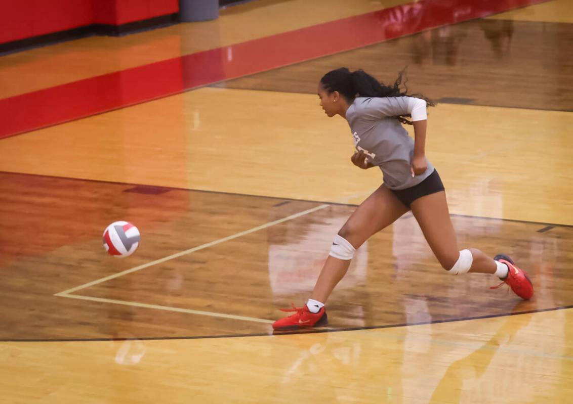 Arbor View's Audrey Jaeck (1) watches as the ball lands just inside the line during a voll ...