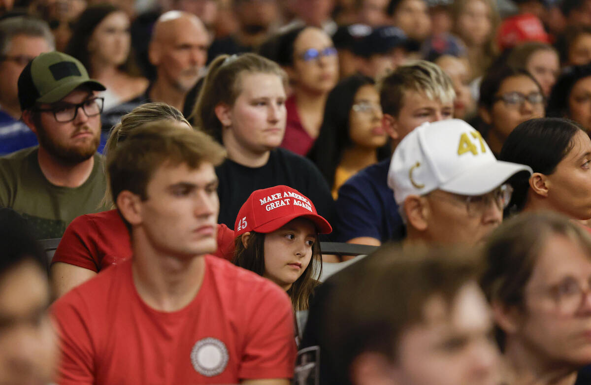 Attendees listen to a speaker during a vigil for Charlie Kirk hosted by Turning Point at the UN ...