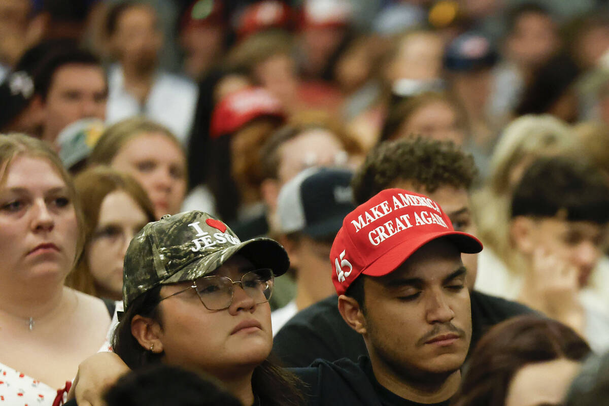 Attendees listen to a speaker during a vigil for Charlie Kirk hosted by Turning Point at the UN ...
