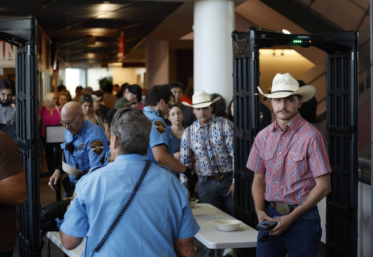 Attendees make their way inside before the start of a vigil for Charlie Kirk hosted by Turning ...