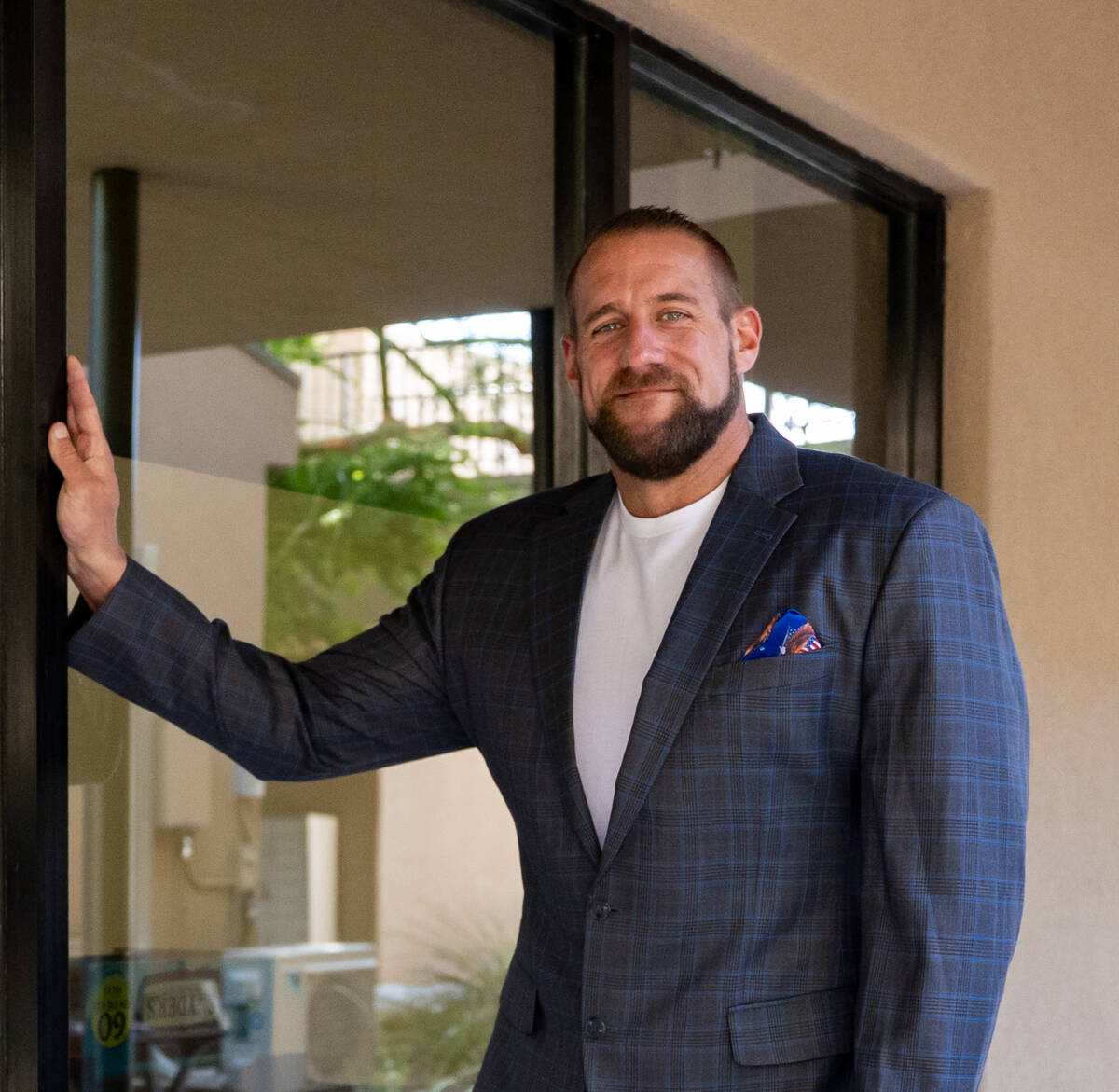 Realtor Mike Roland, owner of The Roland Team, stands for a portrait outside his Henderson offi ...