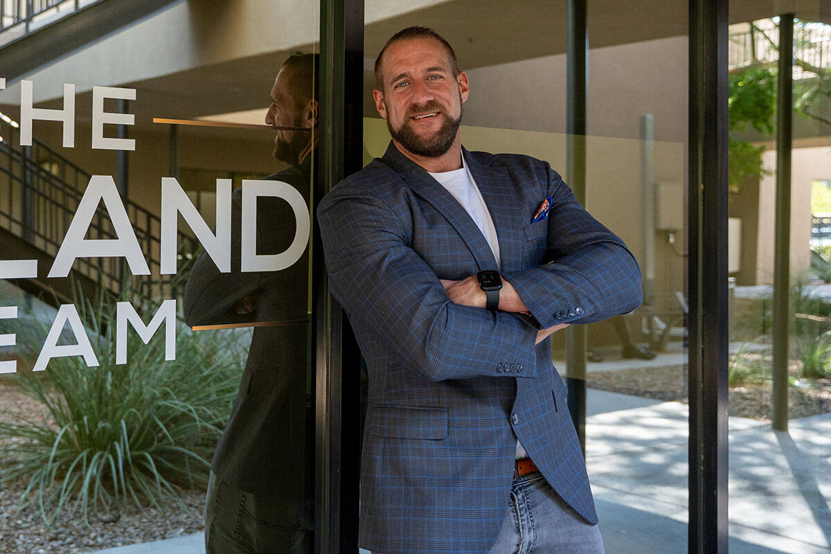 Realtor Mike Roland, owner of The Roland Team, stands for a portrait outside his Henderson offi ...