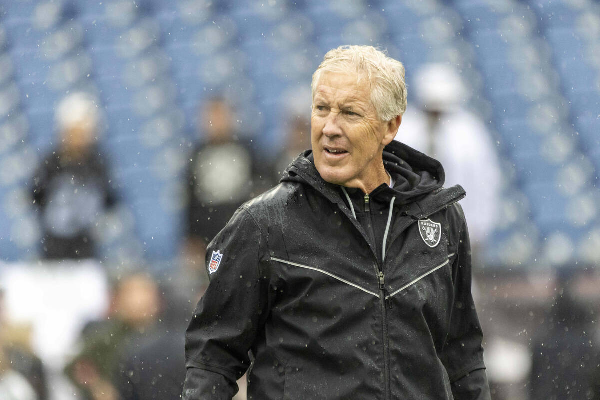 Raiders head coach Pete Carroll takes the field before a game against the New England Patriots ...