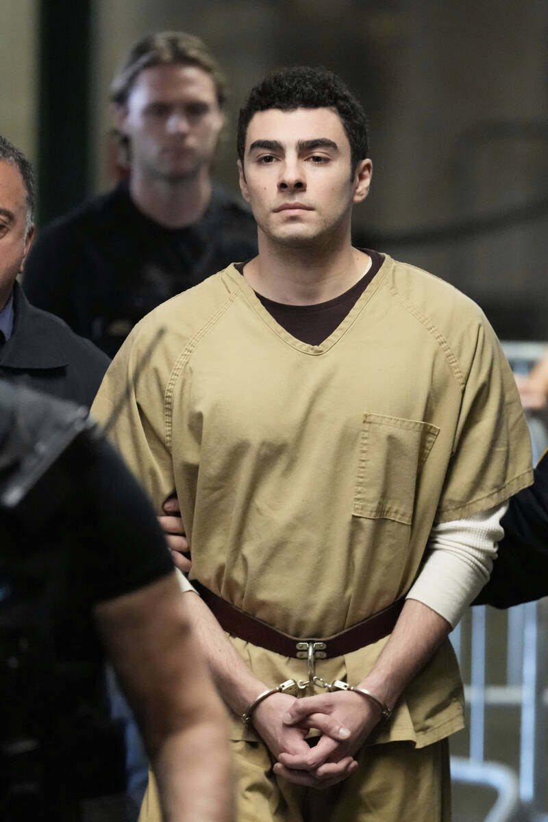 Luigi Mangione is escorted into Manhattan state court in New York, Tuesday, Sept. 16, 2025. (AP ...