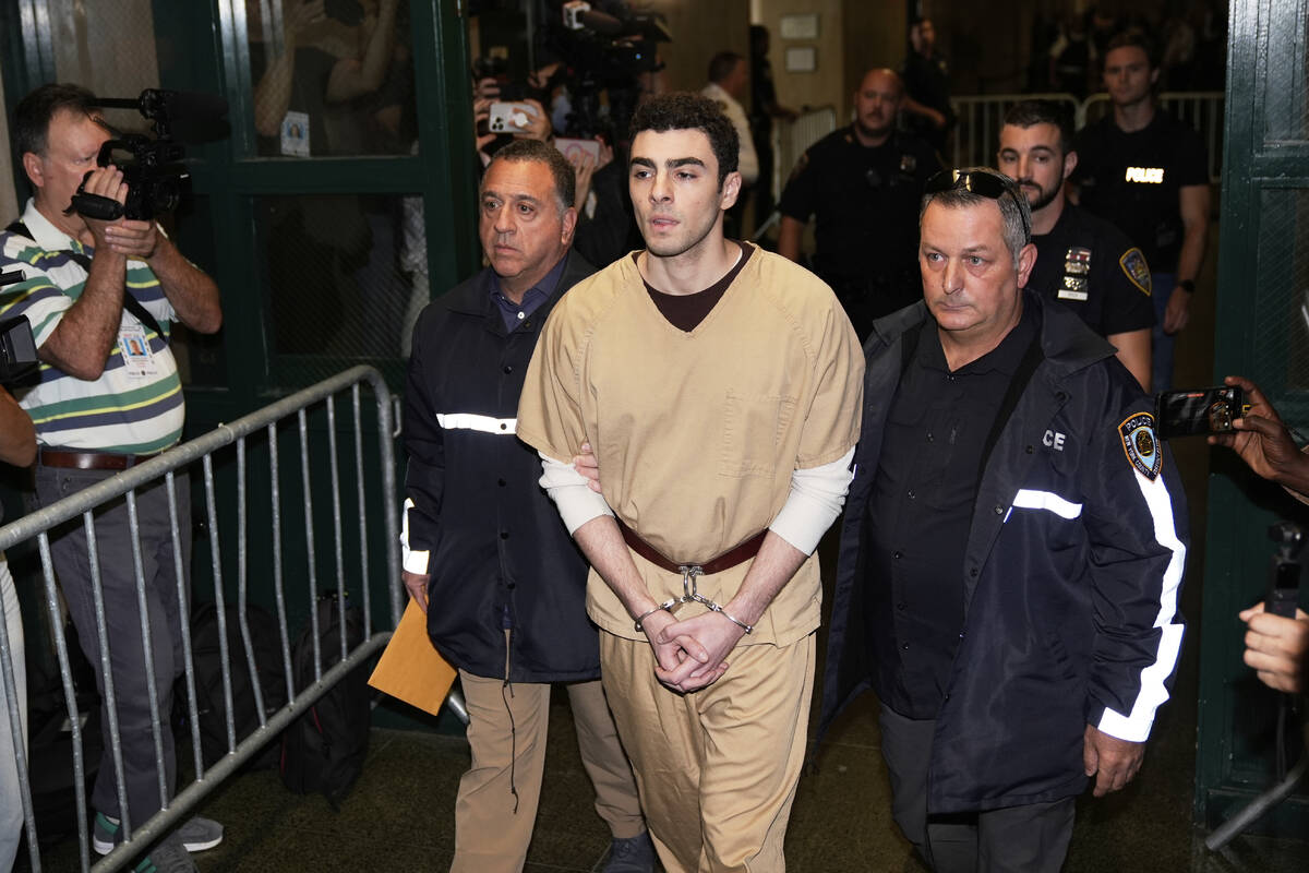 Luigi Mangione is escorted into Manhattan state court in New York, Tuesday, Sept. 16, 2025. (AP ...