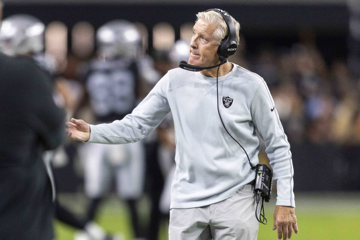 Raiders head coach Pete Carroll gestures from the sideline during the first half of an NFL game ...