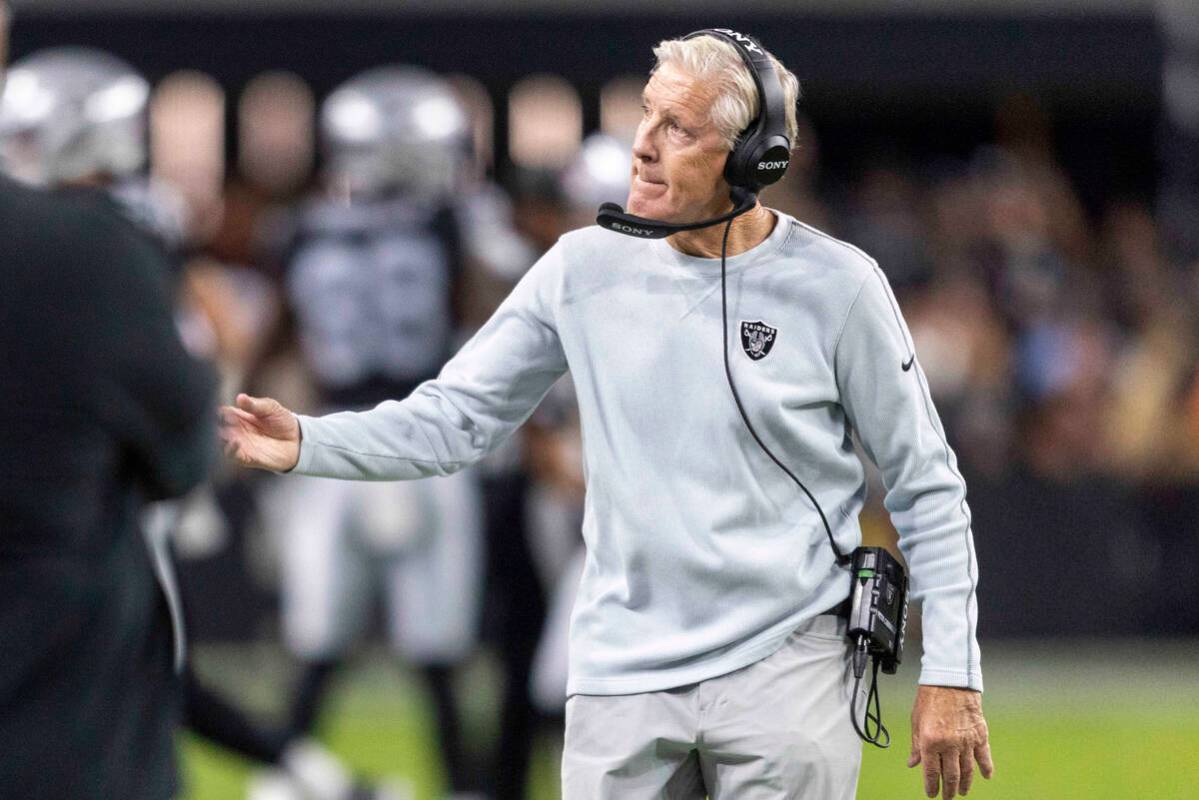 Raiders head coach Pete Carroll gestures from the sideline during the first half of an NFL game ...
