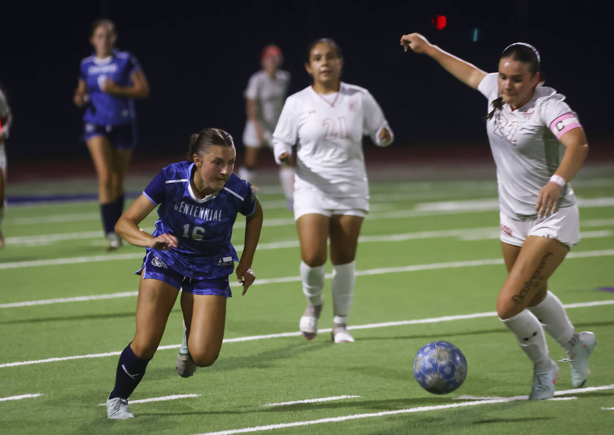 Centennial's Julianne Donnelly (16) and Arbor View's Sydney Smith (22) go for the bal ...