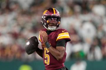 Washington Commanders' Jayden Daniels during the second half of an NFL football game again ...