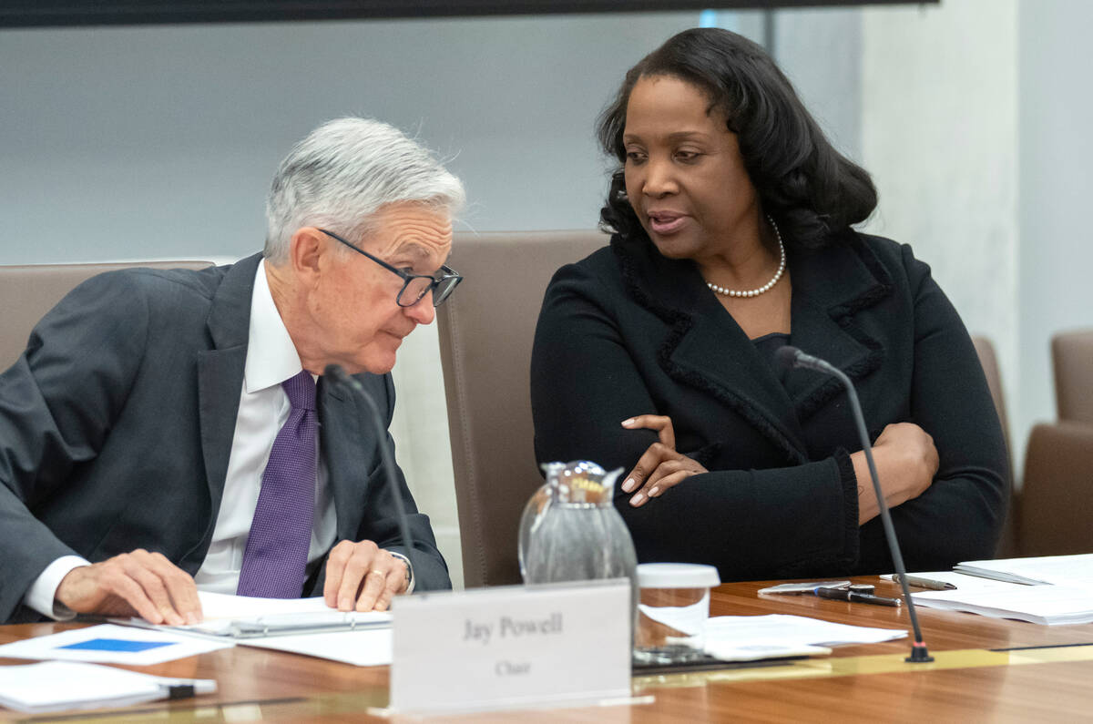 FILE - Federal Reserve Board of Governors member Lisa Cook, right, talks with Federal Reserve C ...