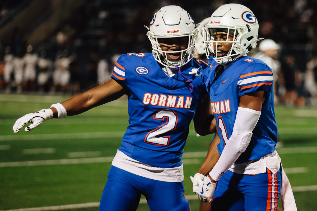 Bishop Gorman wide receiver Zyren Menor (2) celebrates a touchdown by defensive back Isaiah Nic ...