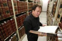 Then-state archivist Guy Rocha looks through documents while working at the State Library and A ...