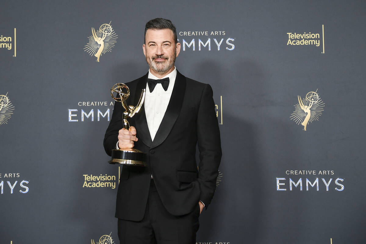 Jimmy Kimmel poses in the press room with the award for host for a game show for "Who Wants to ...