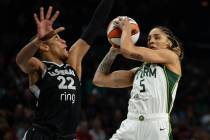 Seattle Storm forward Gabby Williams (5) jumps to take a shot over Las Vegas Aces center A&#039 ...
