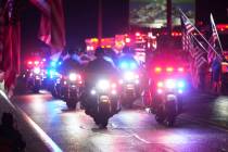 Police officers ride during a procession Wednesday, Sept. 17, 2025, in Spring Grove, Pa., after ...
