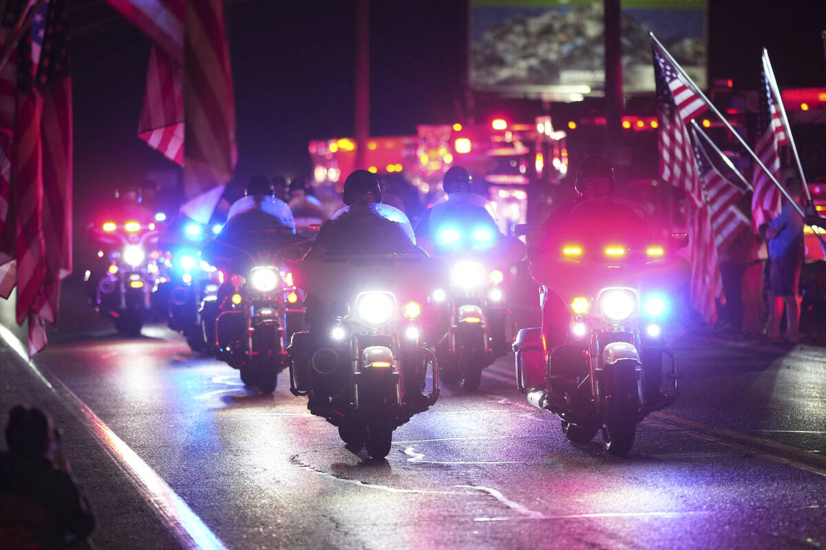 Police officers ride during a procession Wednesday, Sept. 17, 2025, in Spring Grove, Pa., after ...