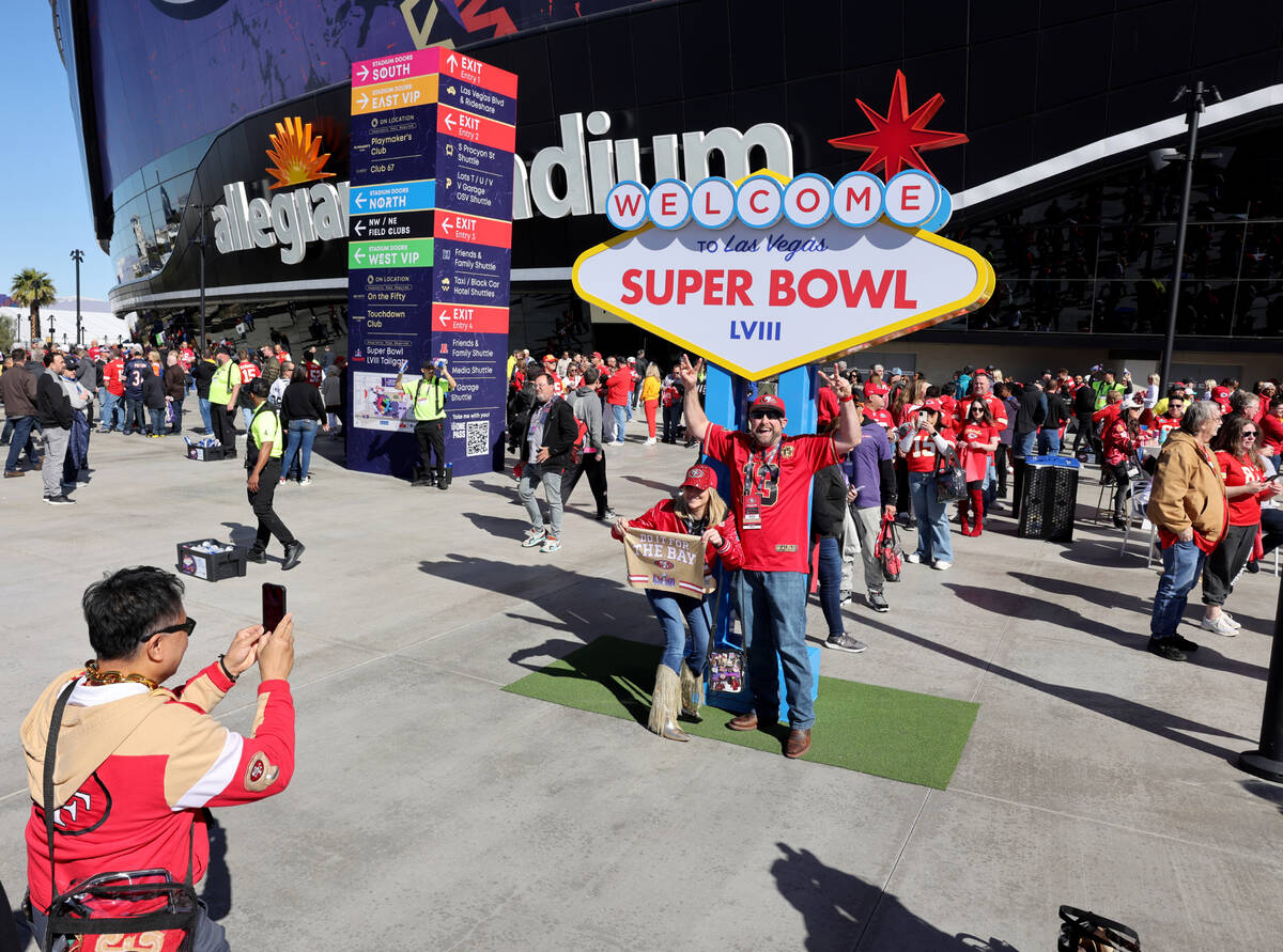 49ers fans Melyssah Morrison and Clinton Meyerhoff of Pacifica, Calif. pose outside Allegiant S ...