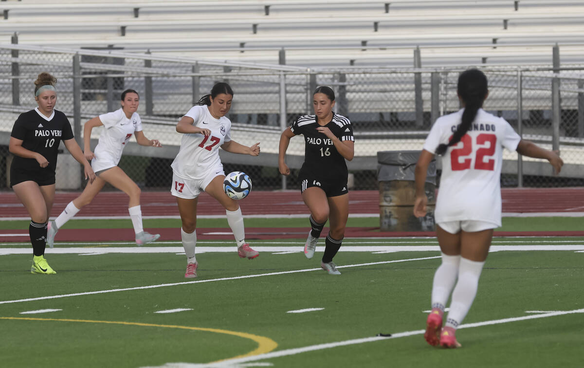 Coronado's Sara Sherman (17) brings the ball up the field under pressure from Palo Verde&# ...