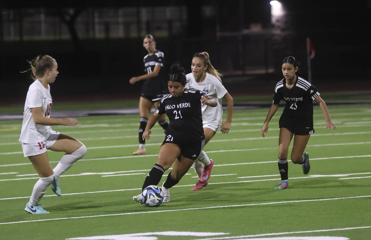 Palo Verde's defender Natalie Reyes (21) works the ball through Coronado defense during a ...