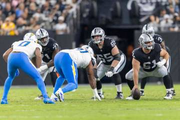 Raiders offensive linemen, from left, DJ Glaze, Alex Cappa and Jordan Meredith line up against ...