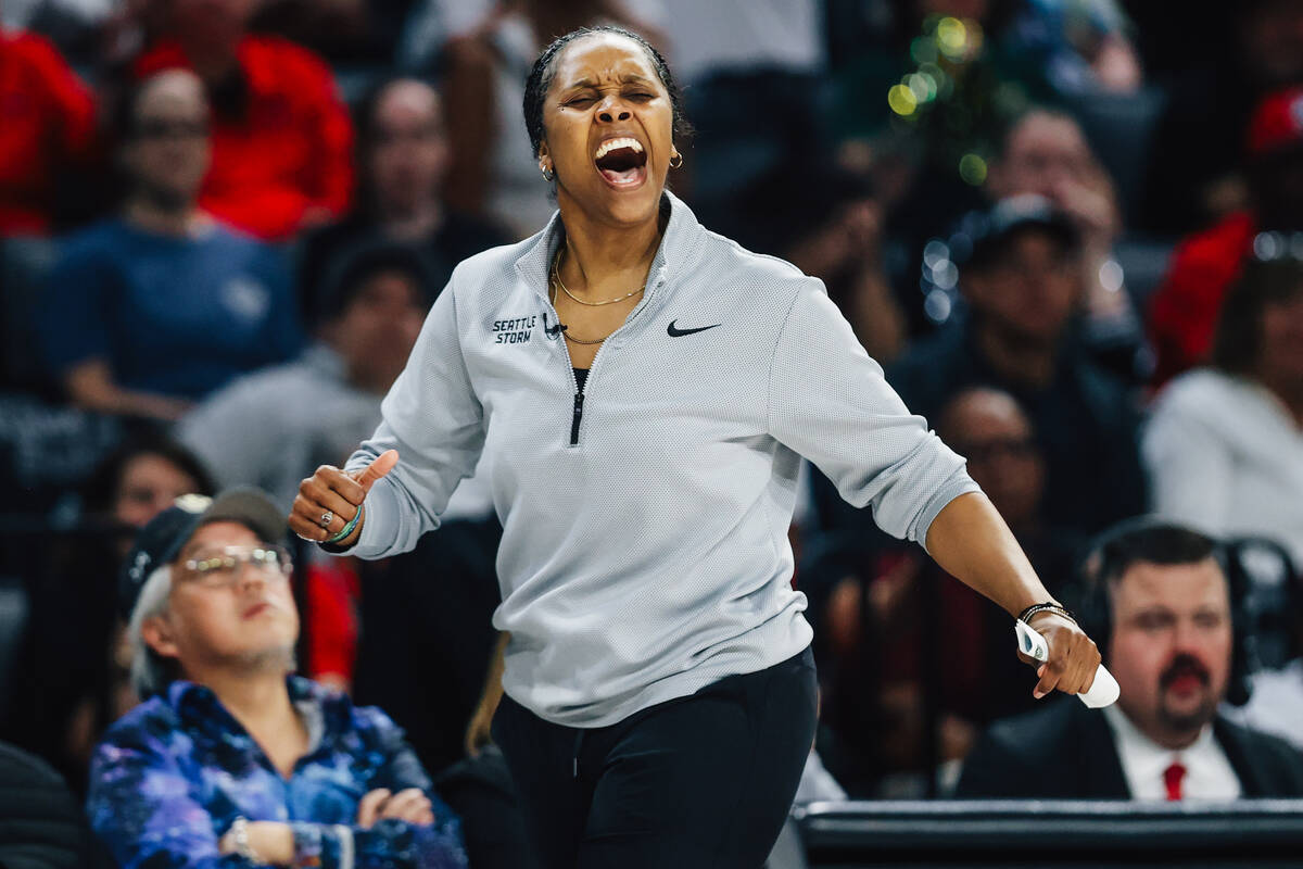 Seattle Storm head coach Noelle Quinn reacts after a basket by the Aces during game three of a ...