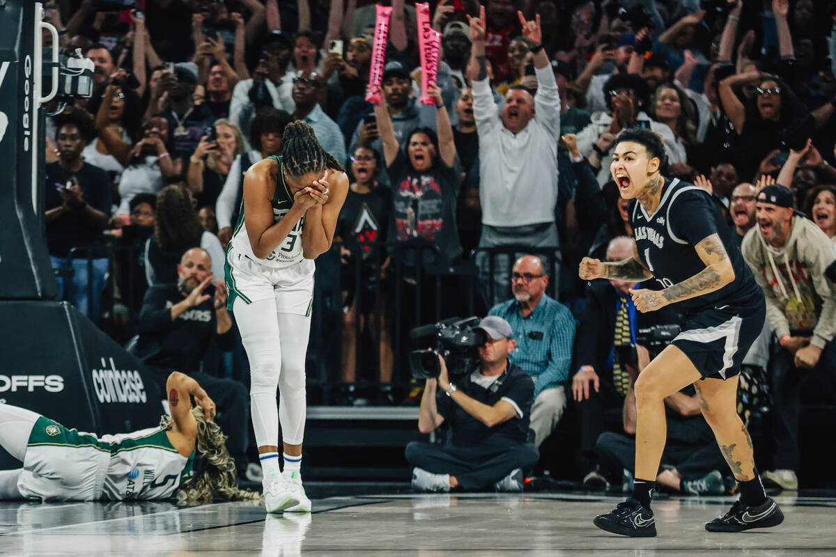 Aces forward Kierstan Bell (1) reacts after a shot by teammate Jackie Young (not in frame) in t ...