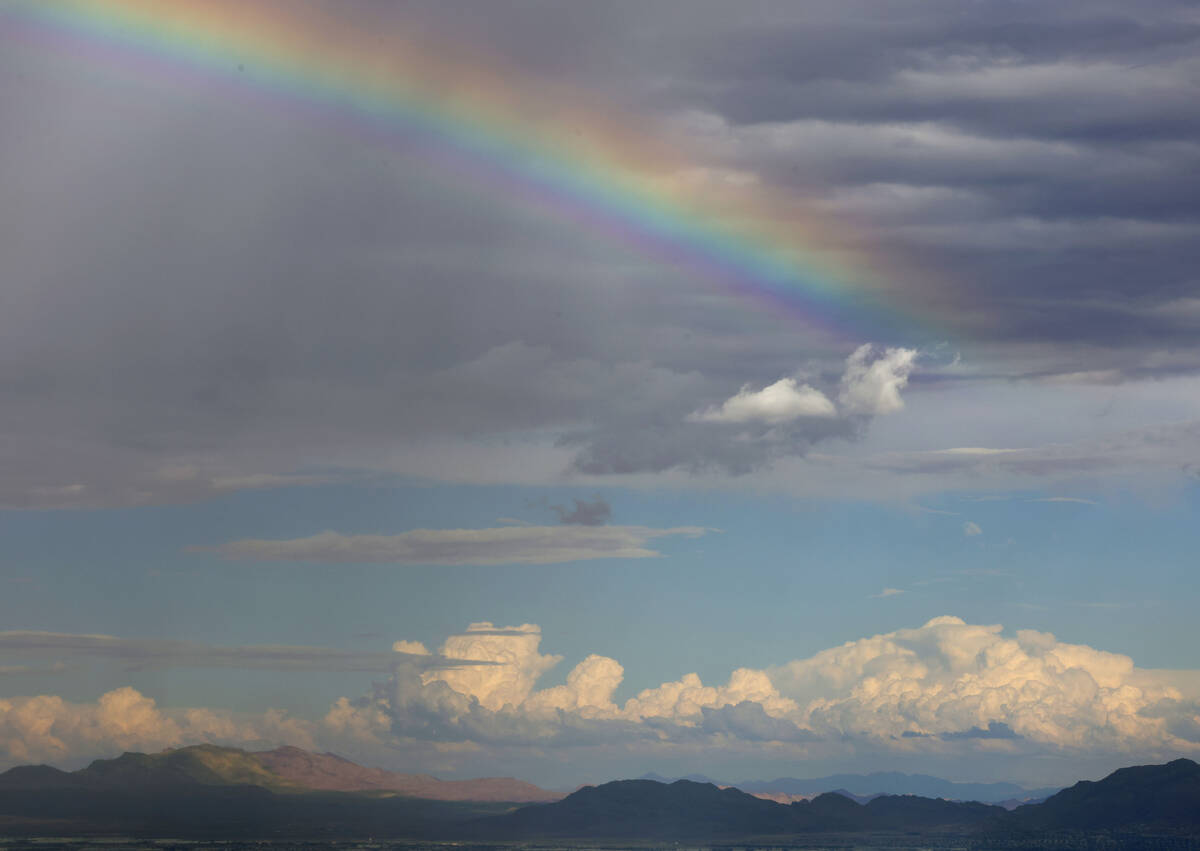 A rainbow stretches across the sky as clouds linger over the Las Vegas Valley as seen from Summ ...